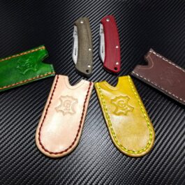 a group of Leather Pocket Slips for the Benchmade Proper on a table.