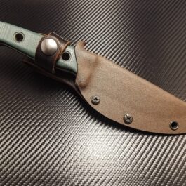 a Benchmade Bushcrafter knife with a Kydex sheath on top of it.