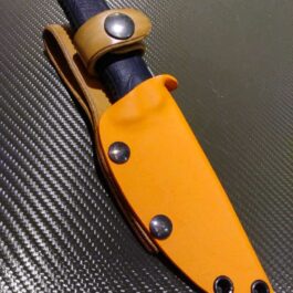 A Kydex sheath for the Benchmade Steep Country sitting on top of a table.