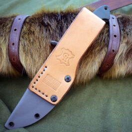 a Benchmade Bushcrafter Kydex Sheath attached to it.