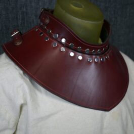 A man wearing a Handmade Leather Gorget Style 2 with a green candle in it.