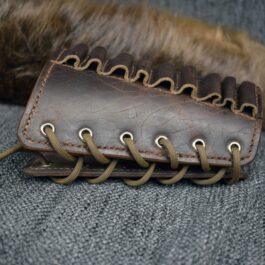 An Upgraded Handmade Leather Buttstock Cover with a leather cord.