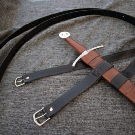 An Integrated Swordbelt Style 2 on a bed.