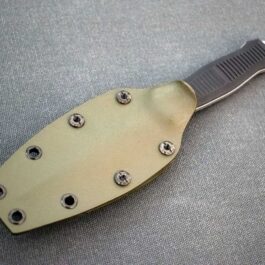 a Kydex Sheath for the Benchmade Fixed Infidel laid on a cloth - renaissance clothing - renaissance clothing men - renaissance clothing women - renaissance clothing near me - renaissance art clothing - renaissance era clothing - renaissance costume ideas