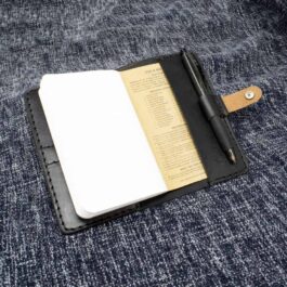 Field Notes Wallet with a pen and notepad attached.
