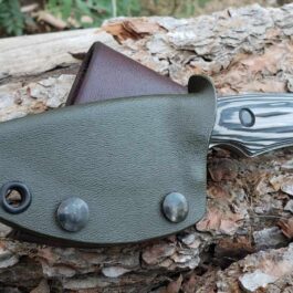 a Vertical Kydex Sheath for Benchmade Hidden Canyon Hunter attached to it.