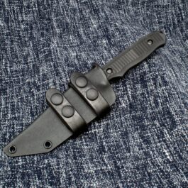 The Scout Style Kydex Sheath for the Benchmade Nimravus is laying on a blue cloth.