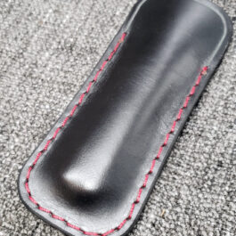 A black Leather Balisong Slip with a red stitch.