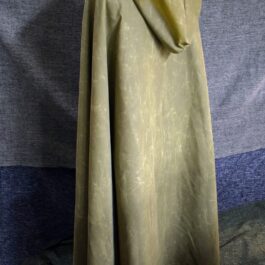 a Waxed Canvas Hooded Cloak on a mannequin with a cloth draped over it.