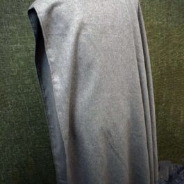 A Wool Bocksten Cloak on a mannequin's head.