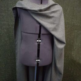 A Wool Bocksten Cloak on top of a mannequin.