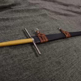 a Wood Core Scabbard for the Albion Liechtenauer with a yellow handle and a black handle.