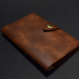 a Field Notes Wallet on a black surface.