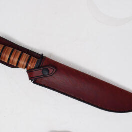 A leather sheath for the Ka Bar Big Brother with a wooden handle on a white surface.