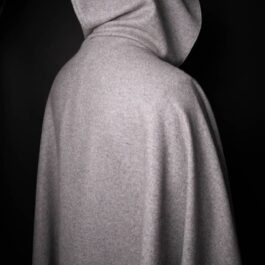 A black and white photo of a Wool Hooded Cloak.