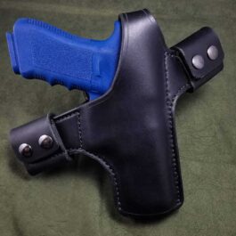 A Handmade Leather Snap Loop Pancake Holster with a blue handle.