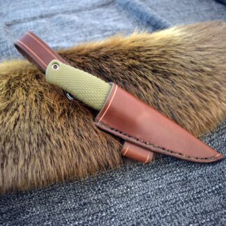 a leather knife holder with fur on top of it.