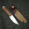 a knife with a brown sheath and a brown sheath.