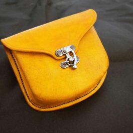 a Molded Leather Belt Pouch with a pair of scissors in it.