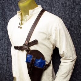 a mannequin wearing a brown leather holster.
