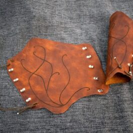 A pair of Soft Leather Mirkwood Vambraces with studs on them.