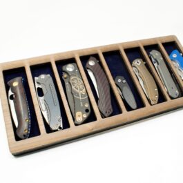 A Wooden Valet Tray with six knives.