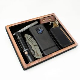 A Wooden Valet Tray with a cell phone and a pen.