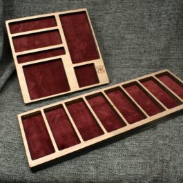 A Wooden Valet Tray sitting on top of a couch.