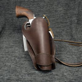 a brown leather sheath with a wooden handle.