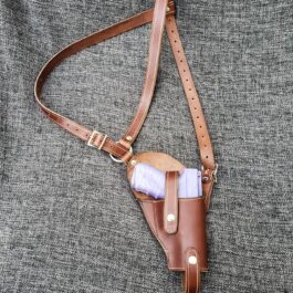 a brown leather belted holster with a pair of white socks in it.