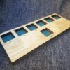 a wooden board with four different windows on it.