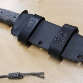 A Kydex Sheath for the Chris Reeve Pacific with a cord attached to it.