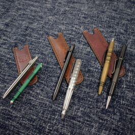 Three pens and a Leather Pen Pocket Slip.