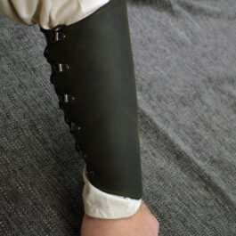 a person with Soft Leather Mirkwood Vambraces on their arm.