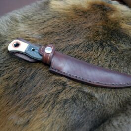 a brown leather sheath with a metal handle.