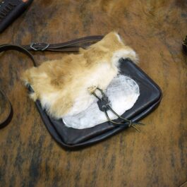 The Eastern legend Satchel with a piece of fur on top of it.
