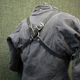 a back view of a jacket with a harness on it.