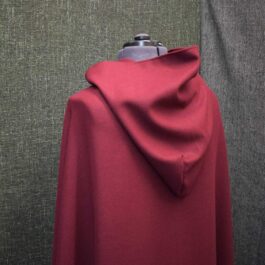 A mannequin is covered with a Wool Hooded Cloak.
