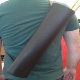 A man holding a large black Basic Back Quiver on his back.