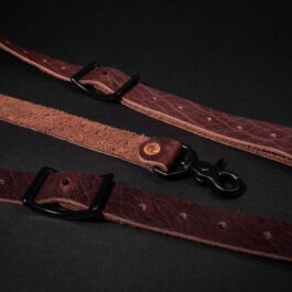 A pair of Bison Leather Suspenders on a black background.