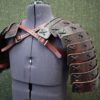 A mannequin wearing Samurai Style Shoulder Armor with spikes.