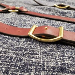 a close up of Lumberjack Suspenders with a gold buckle.