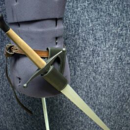 A Handmade Leather Sword Hanger stuck in the back of a chair.