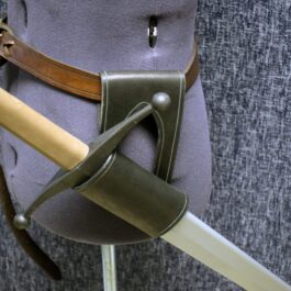 A close up of a uniform with a Handmade Leather Sword Hanger.