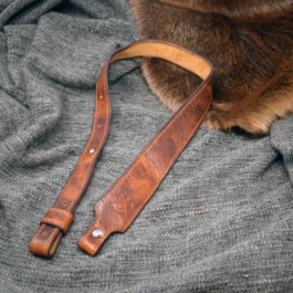 brown Bison Leather Cobra Sling laid on a cloth - renaissance clothing - renaissance clothing men - renaissance clothing women - renaissance clothing near me - renaissance art clothing - renaissance era clothing - renaissance costume ideas