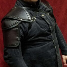 A man in a black shirt with a Leather Shoulder Armor Style 2.