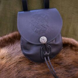 A Large Sporran Belt Pouch sitting on top of a fur rug.