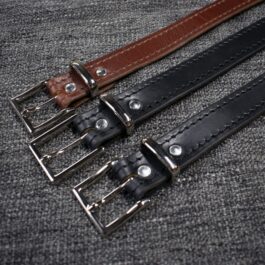 two black and one brown Handmade Leather Dress Belt laid on a cloth - renaissance clothing - renaissance clothing men - renaissance clothing women - renaissance clothing near me - renaissance art clothing - renaissance era clothing - renaissance costume ideas