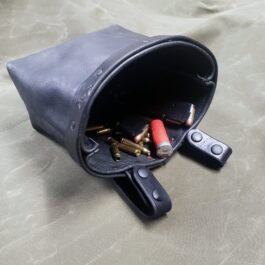 a black Bison leather Dump Bag with a bunch of bullet casings in it.