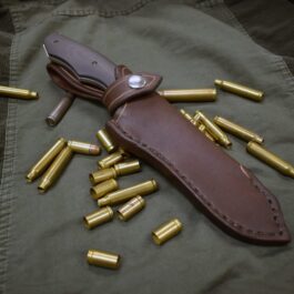 A Leather Sheath for the Benchmade Fixed Contego with bullet casings and a Leather Sheath for the Benchmade Fixed Contego.